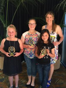 Under 13 award winners from left, Brie Burgess (most consistent), Amelia Hoffmann (team player), Marissa Lovell (most valuable), Courtney Nourse (coach)