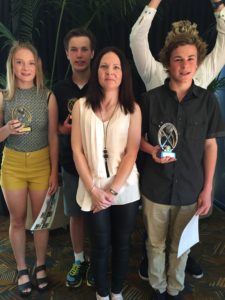 Under 15 Green award winners from left, Tyler Burgess (most consistent), Aaron Blewett (most improved), Deb Middleton (coach), Wilbur Bishop (best and fairest)