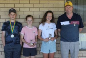 Under 13 Green (left to right): Owen Riebke (Best & Fairest), Tessie Kennedy (Most Consistent), Eve Doecke (Most Determined) & Brad Fairey (Coach).